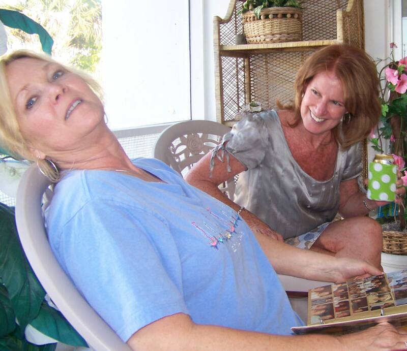 Marsha & Lynn goofing on the porch...